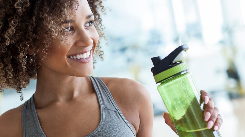 Healthy woman with water bottle